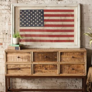 large framed american flag under glass