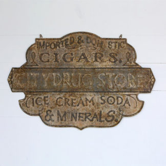 vintage embossed metal drug store sign