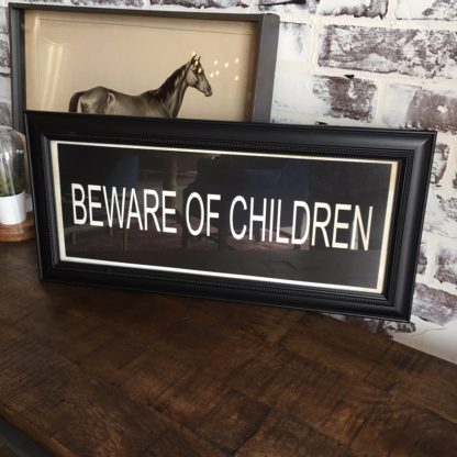 BEWARE OF CHILDREN Framed Print