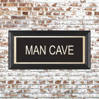 MAN CAVE Framed Print